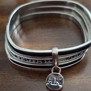 Silver and Black Bangle Bracelet with Charm